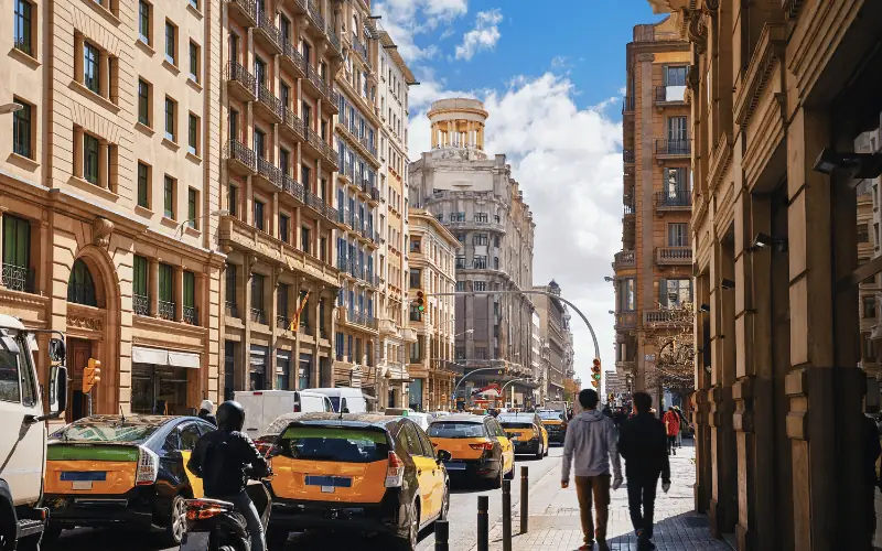City traffic in central Barcelona with historic architecture and busy streets